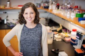 Molly Schumer stands in a biology laboratory