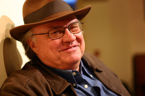 Kenneth Fields wearing glasses and wide-brimmed hat