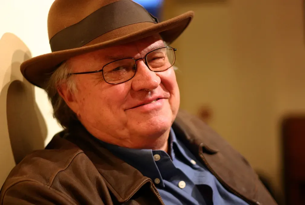 Kenneth Fields wearing glasses and wide-brimmed hat